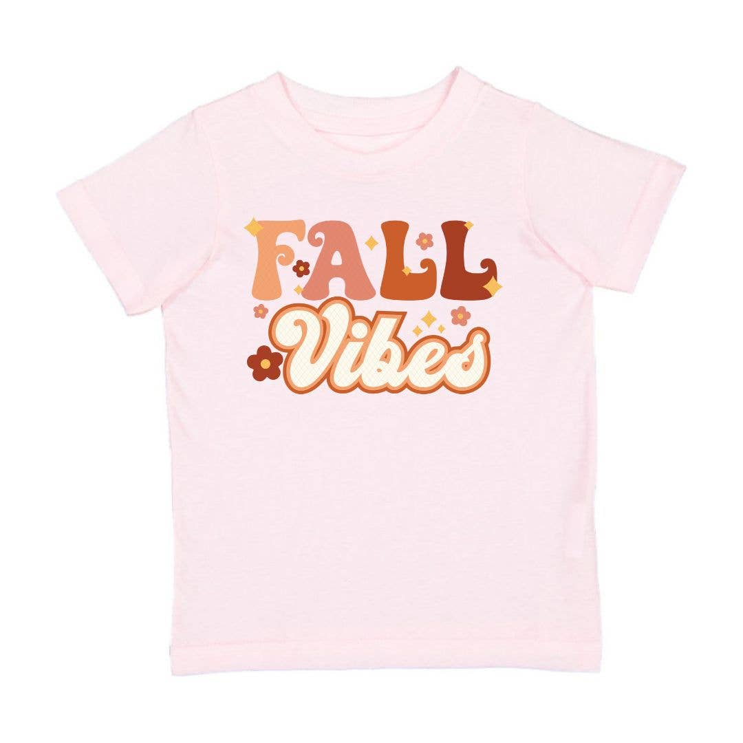 The Fall Vibes Short Sleeve T-Shirt is a fun and festive t-shirt for kids celebrating Fall! Features: * Shirt Color: Ballet Pink * Graphic Color: Multicolor * Material: 100% Cotton * Features: Tagless inside neck label for an itch-free wear * Fit: Toddler Unisex; True to Size * Care: Machine washable, tumble dry low, wash with like colors Each shirt is hand pressed with love using baby and child safe inks.