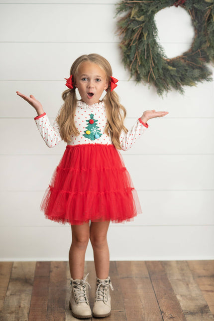 Girls red & white polka dot long sleeve top has pom pom Christmas Tree, ruffle collar and keyhole back closure. Red tiered tulle layers complete this fun festive Holiday Party dress! Top: 95% Polyester, 5% Spandex Tulle: 100% Polyester