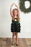 Girls two piece set includes red & white candy cane top with green velvet ruffle Christmas tree jumper dress. Cute pom pom and star applique details make this set a holiday classic.