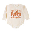 The Cutest Pumpkin In The Patch Long Sleeve Romper is a fun and cute romper for babies celebrating Fall! Features: * Romper Color: Natural * Graphic Color: Burnt Orange * Material: 100% Cotton * Features: Tagless inside neck label for an itch-free wear; 3 snap closure; cuffed sleeves; trendy bubble style * Fit: Infant Unisex * Care: Machine washable, wash inside out, lay flat to dry, wash with like colors Each romper is hand pressed with love in our hometown warehouse.