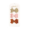 Every little girl needs the perfect hair clip to complete her look! The Golden Blush Bow Clip Set is the perfect hair accessory for celebrating fall. This clip set includes: * 1 gold glitter bow hair clip * 1 pink glitter bow hair clip * 1 burnt orange glitter bow hair clip Customers love Sweet Wink hair clips because: * Each alligator hair clip is ribbon-covered to grip the hair * One size fits all * Glitter accents are 