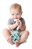 The Teether Tether is a convenient clip that attaches to all fabrics to ensure baby's most soothing toys and pacifier stay close and clean. The Tether is made of soft, flexible, food-grade silicone with textures that gently massage baby's gums. One size. 3+ Months.